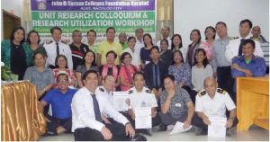 Faculty and staff presenters face the panel at 2016 Bacolod Unit Research Colloquium